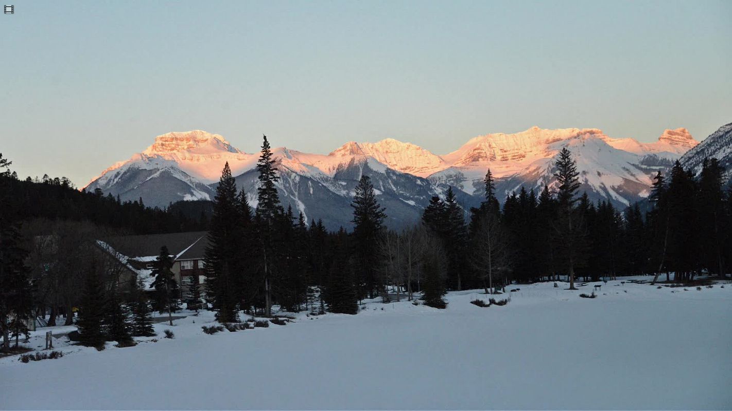Banff Time Lapse Winter Moonset and Sunrise on  Mount Bourgeau, Mount Brett, Massive Mountain and Pilot Mountain From Bow River bridge